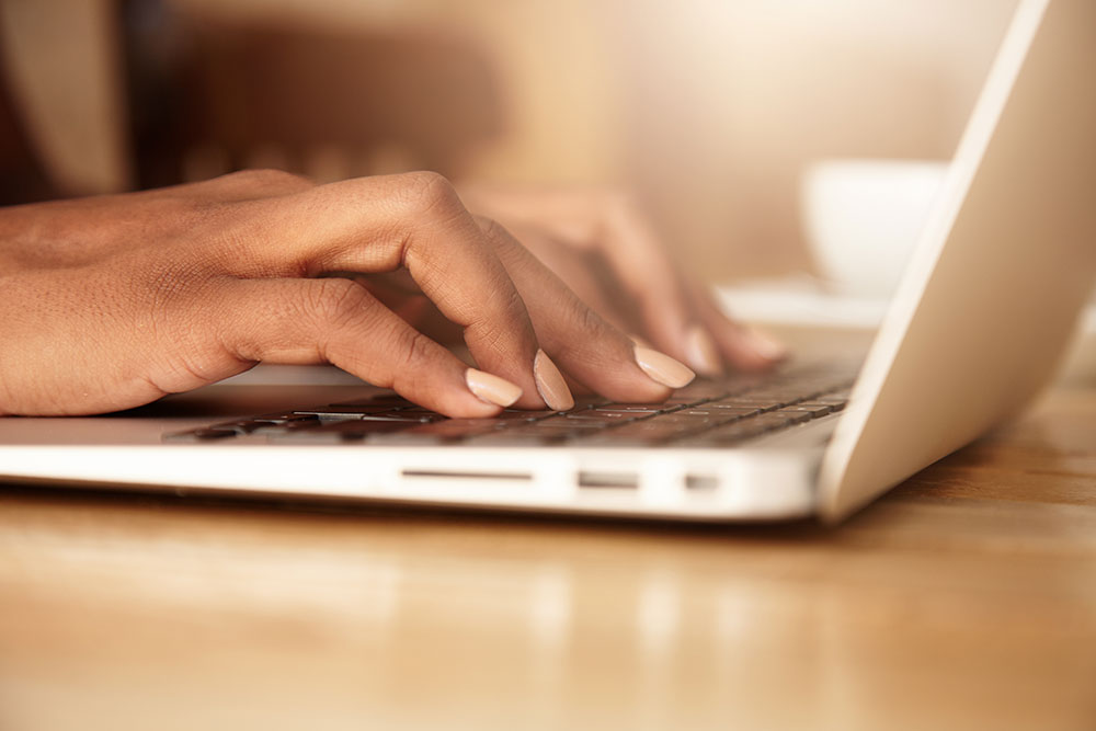 closeup-female-typing-laptop-keyboard